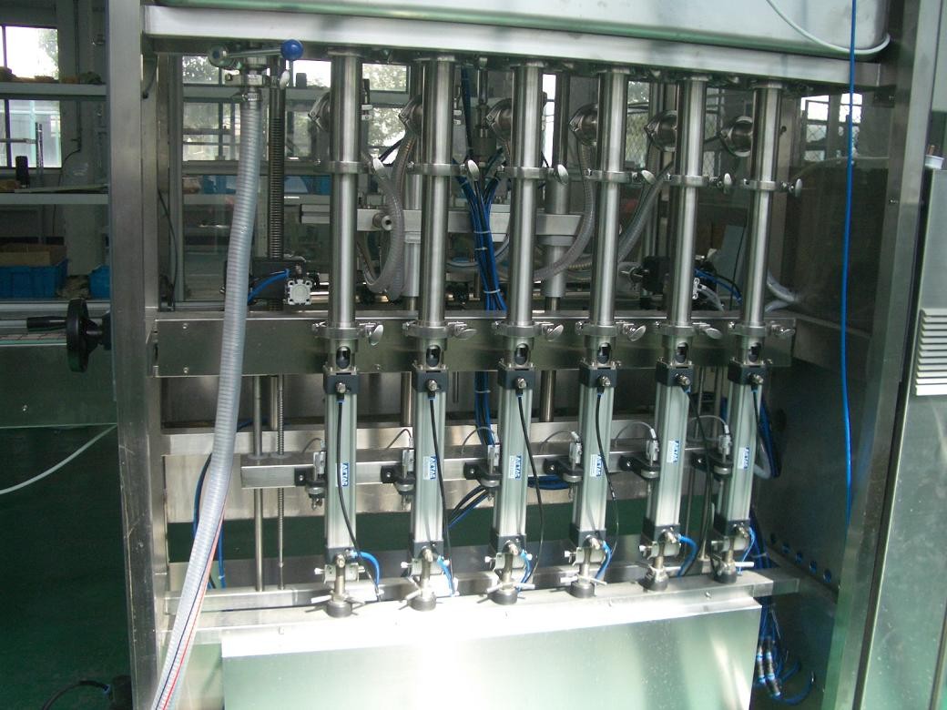 Quality 25 ~ 30 bpm Piston Filling Machine with 6 to 12 filling nozzles for Oil, Syrup & Detergent for sale