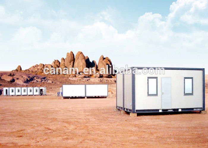 small moving modified shipping containers homes with pillars  and two windows.jpg