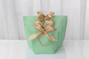 China Stamping Logo Light Green Cosmetic Shopping Bag Bow Tie Ribbon White Gift Bag on sale
