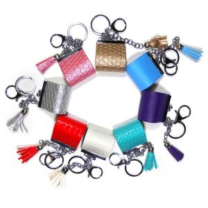 Quality Sliver Plating Smooth Surface Coin Bag Keychain With Red Tassel for sale
