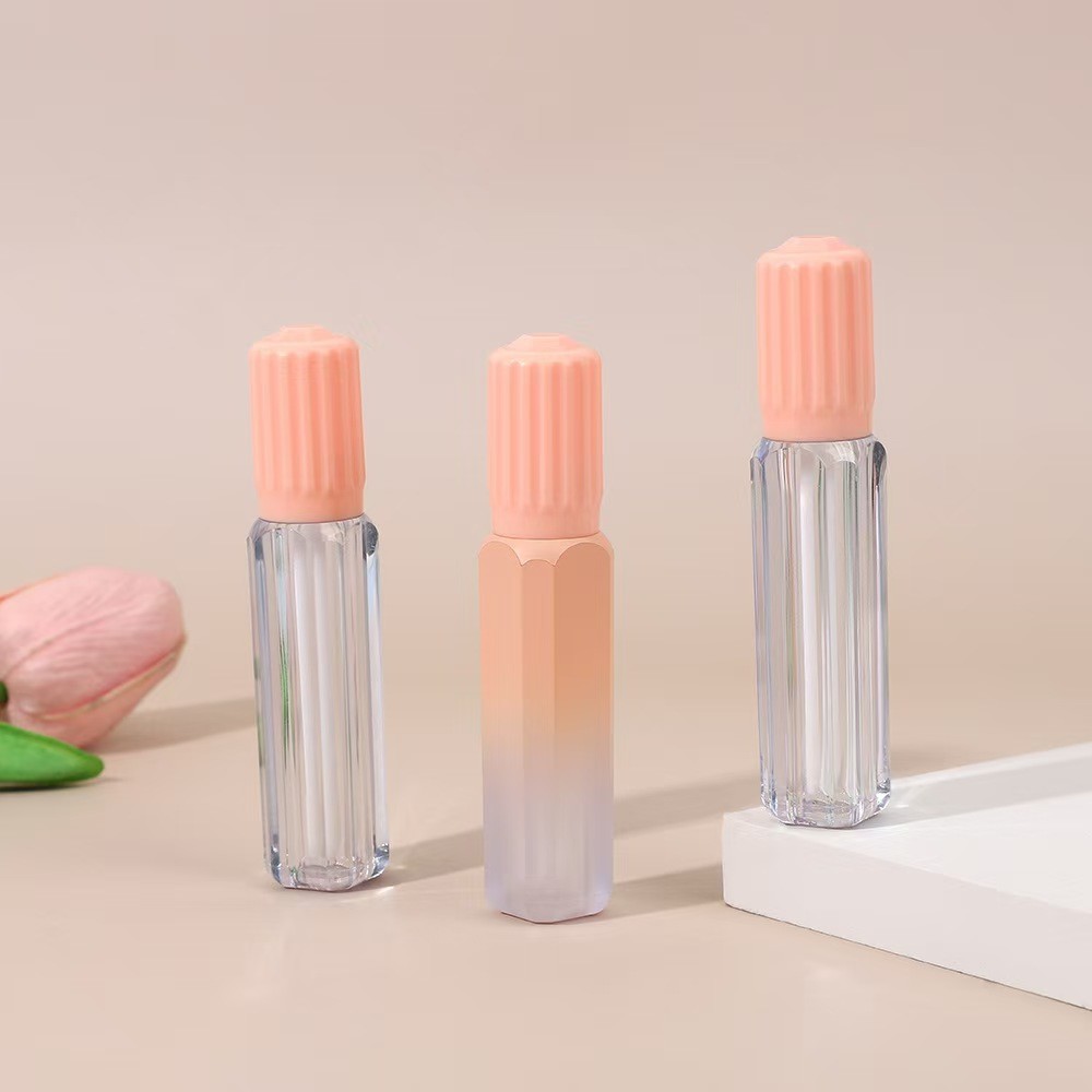 Design gear cover with brush plastic lip glaze tube in various colors