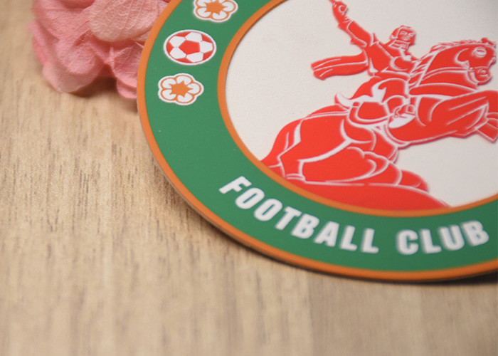 Raised Silicone Logo screen printed patches On A White Microfibre Background For Garments